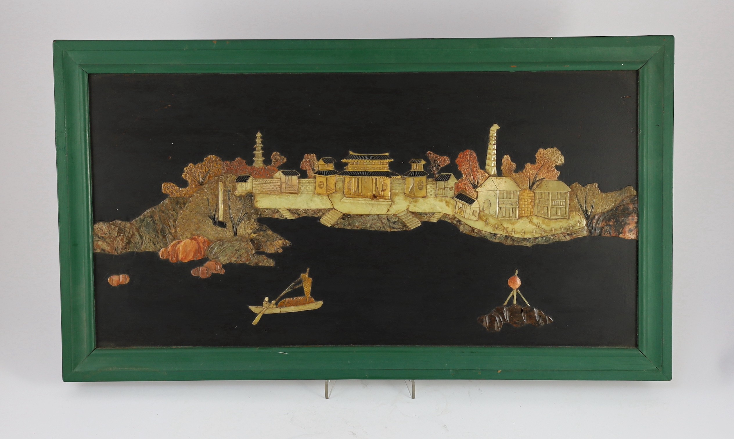 A pair of Chinese soapstone overlaid landscape panels, early 20th century, 53 cms wide x 26.5 cms high